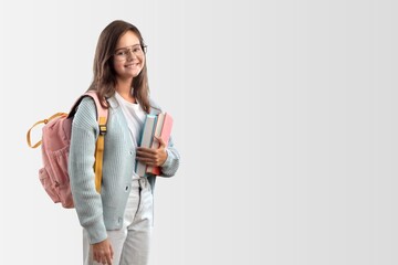 School teenager child girl with school bag book and copybook. Learning and knowledge. Positive and smiling emotions.