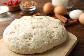 Fototapeta na wymiar Board with wheat dough for pastries, closeup