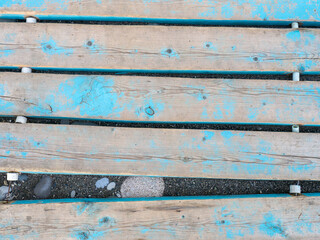 Blue worn boardwalk. Boards leading to the beach. wooden boards.