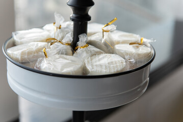 White chocolate covered cookies are individually wrapped for party guests to take and a gift