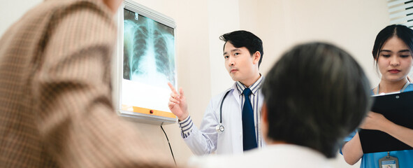 professional physician doctor and medical health person explaining x-ray film result examining to patient at hospital, talking about medicine diagnosis care and disease expertise clinic