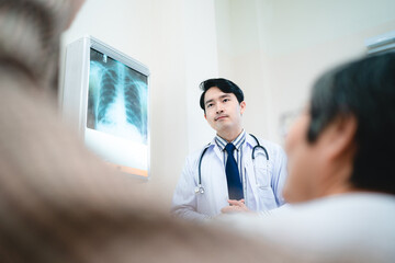 professional physician doctor and medical health person explaining x-ray film result examining to patient at hospital, talking about medicine diagnosis care and disease expertise clinic