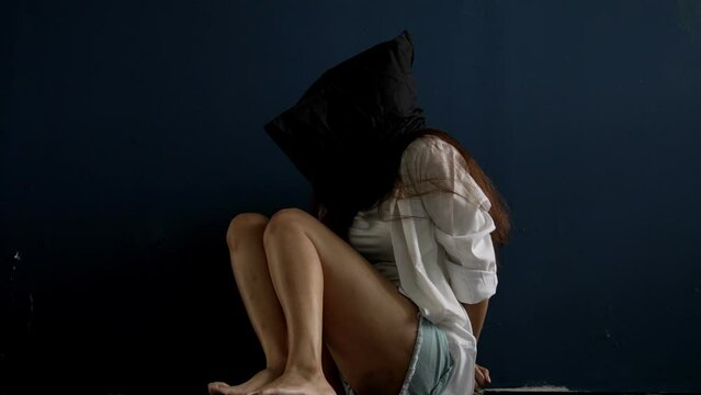 Hostage woman modle was captured by the villain. Criminal and villain concept.