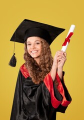 A pretty female graduate standing. Student with bachelor, master degree smiling,