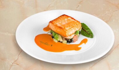 Tasty fish fillet on a white plate