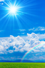 Plakat 草原と青空に虹と太陽