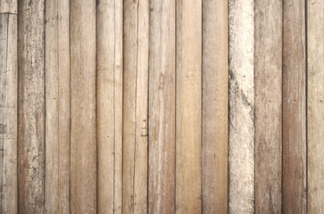 Natural white beige log wall texture background. Fence lined with old logs.