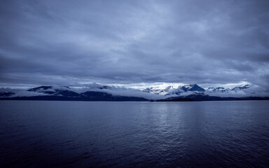 Fototapeta na wymiar icy mountain near water 