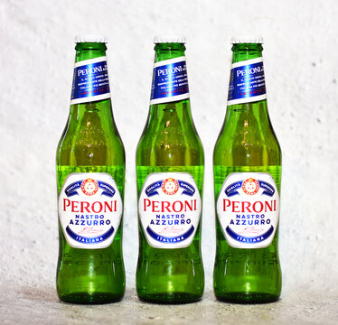 Three Peroni Beer Bottles