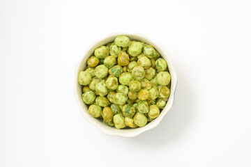 Crispy Green Peas Coated with Wasabi in porcelain cup isolated on white background.
