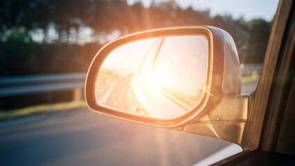 Road trip car mirror. Sun, highway car road reflection in mirror. Summer holidays trip concept.