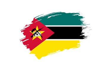 Creative hand drawn grunge brushed flag of Mozambique with solid background