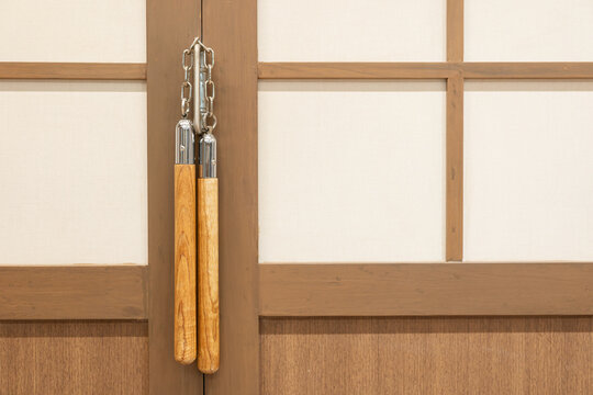 Nunchuks. Wood nunchuks with metal chain. Wooden nunchaku. - Powered by Adobe