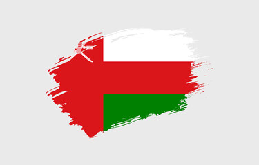 Creative hand drawn grunge brushed flag of Oman with solid background