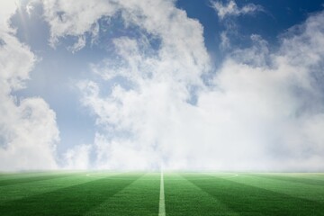Football pitch under blue sky