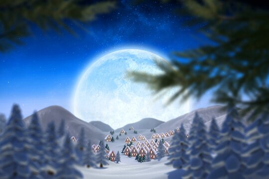 Cute christmas village under huge full moon