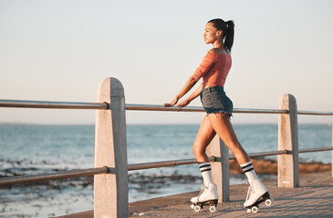 Summer, roller skate and black woman at beach promenade for fitness freedom, fun exercise and hobby training. Relax, calm and sunshine nature with young skating culture, cool urban girl and sea youth - obrazy, fototapety, plakaty