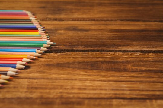 Color pencils on wooden table