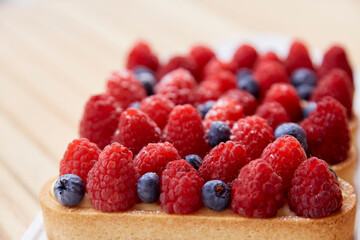 Natural french sugar free blueberry and raspberry tartlets close up. Top view food. Aesthetic food