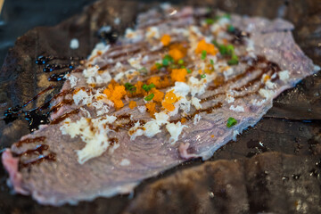 Raw wagyu beef on Hoba leaf. Japanese food style.