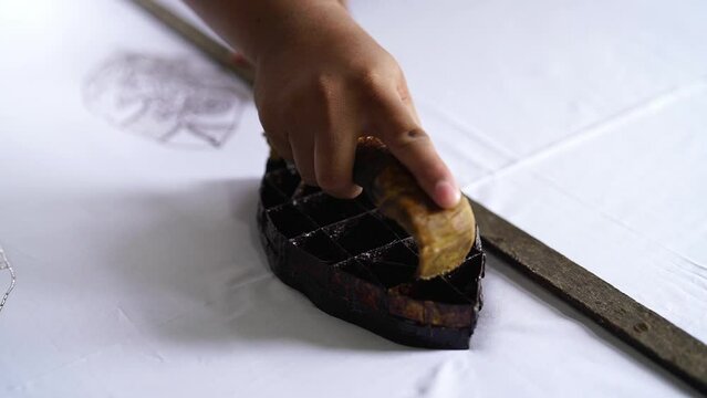 batik stamp process copper stamps hot ink create motif onto fabric.