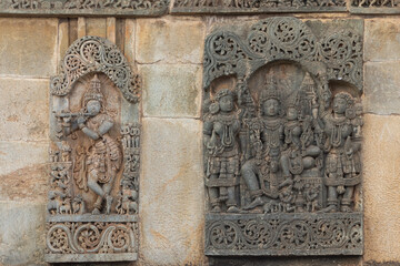 The Sculpture of Lord Shiva Parvati and Lord Krishna With Flute on the Chennakeshawa Temple, Belur, Hassan, Karnataka, India.