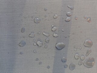 Water drops on a gray woven surface