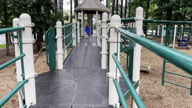 Toddler running on playground, High Point City Lark Park