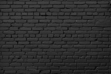 Black brick wall background. Dark brickwork. Copy space.