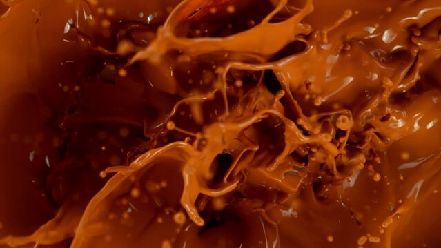Super Slow Motion Shot of Caramel Chunks Falling into Melted Caramel at 1000fps.