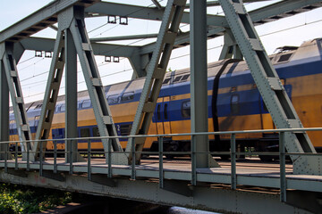VIRM doubledecks intercity train along the rail bridge at Kethel in schiedam