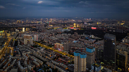 Fototapeta na wymiar Cityscape of Changchun, China under the setting sun