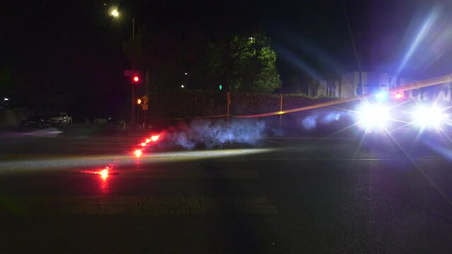 police using road flares to shut down intersection 
