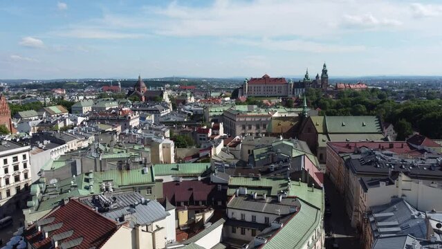 View of Wawel Royal Castle Cathedral from the Main Square - City Centre flyover of Krakow, Poland, a Polish cultural capital, with medieval and renaissance architecture - 4K 30FPS Tracking Up