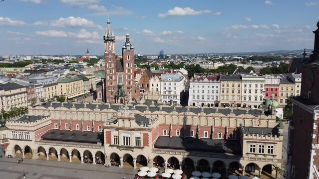 St. Mary's Basilica (Bazylika Mariacka), Clock Tower at the Main Square in Krakow, Poland, a Polish cultural capital, with medieval and renaissance architecture - 4K 30FPS Smooth Tracking Forwards