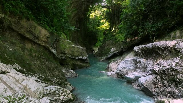 Flying Through Abasha River Flowing Between Mossy Rocks In Martvili Canyon, Georgia. Aerial Shot