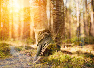 double exposure photo of footsteps in the woods 