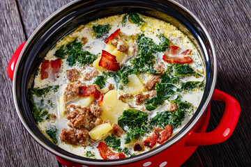 Zuppa Toscana,Tuscan Soup in red pot, top view