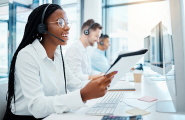 Contact us, customer support and happy call center consultant working in office, smiling while...