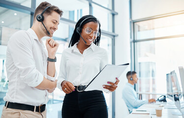 Call center, telemarketing and about us CRM consultants reading faq and qa training manual in a modern office. Collaboration, teamwork and diversity with man and woman at a customer support agency - obrazy, fototapety, plakaty