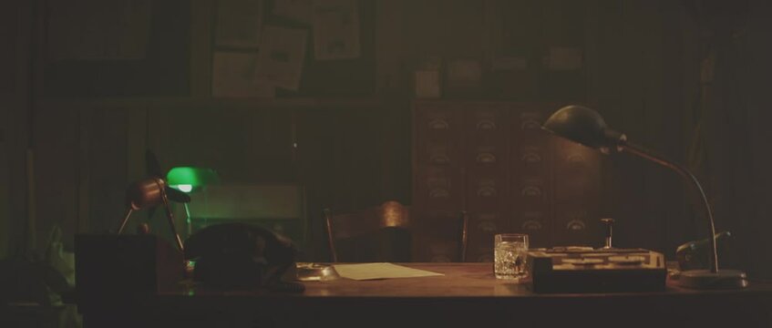 Empty style office lighted by dimmed desk lamp. Retro style detective using deduction for solving challenging cases.