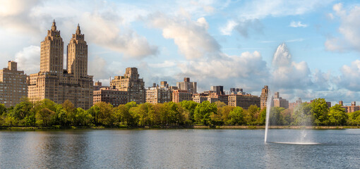 Skyline panorama with Eldorado building and reservoir with fountain in Central Park in midtown...