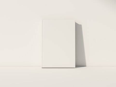 White Book Mockup front view with blank hard cover standing on white table. 3d rendering