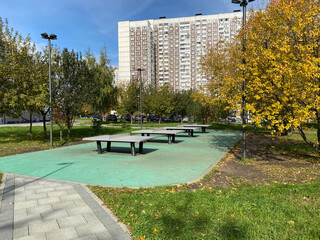 table tennis tables in park  at dry sunny fall day