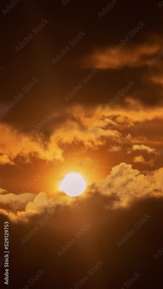 Wall mural timelapse of dramatic sunrise with orange sky in a sunny day.