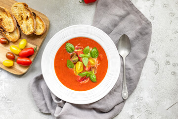 Tomato soup with fresh, crunchy vegetables and herbs. Served cold with hot bread. Spanish gazpacho recipe.