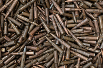 Bullets on table as background, close up view.