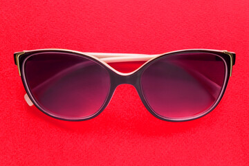 Siunglasses on red background