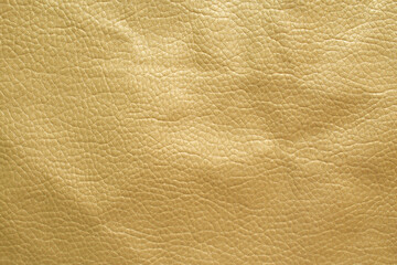 Genuine leather texture background. Gold artificial leather leather background.