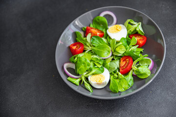 green salad egg, vegetable  tomato, onion, leaves lettuce mix fresh healthy meal food snack on the table copy space food background 